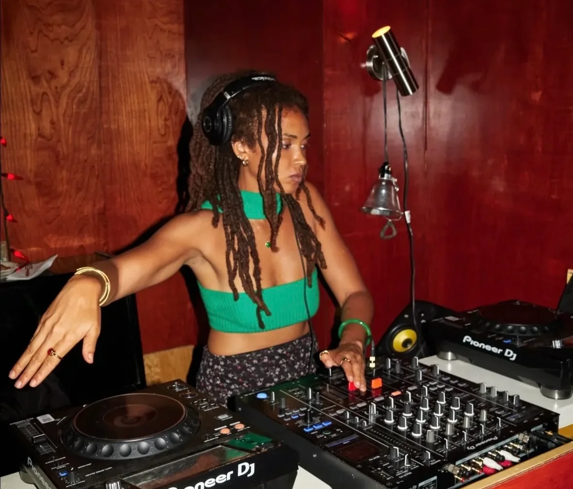 Ayanna Heaven, female wedding DJ NYC, performing on Pioneer DJ equipment at a club