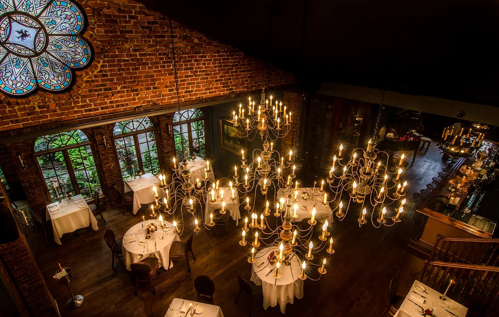 Candlelit dining room at One if By Land, Two If By Sea, a romantic wedding venue in NYC.