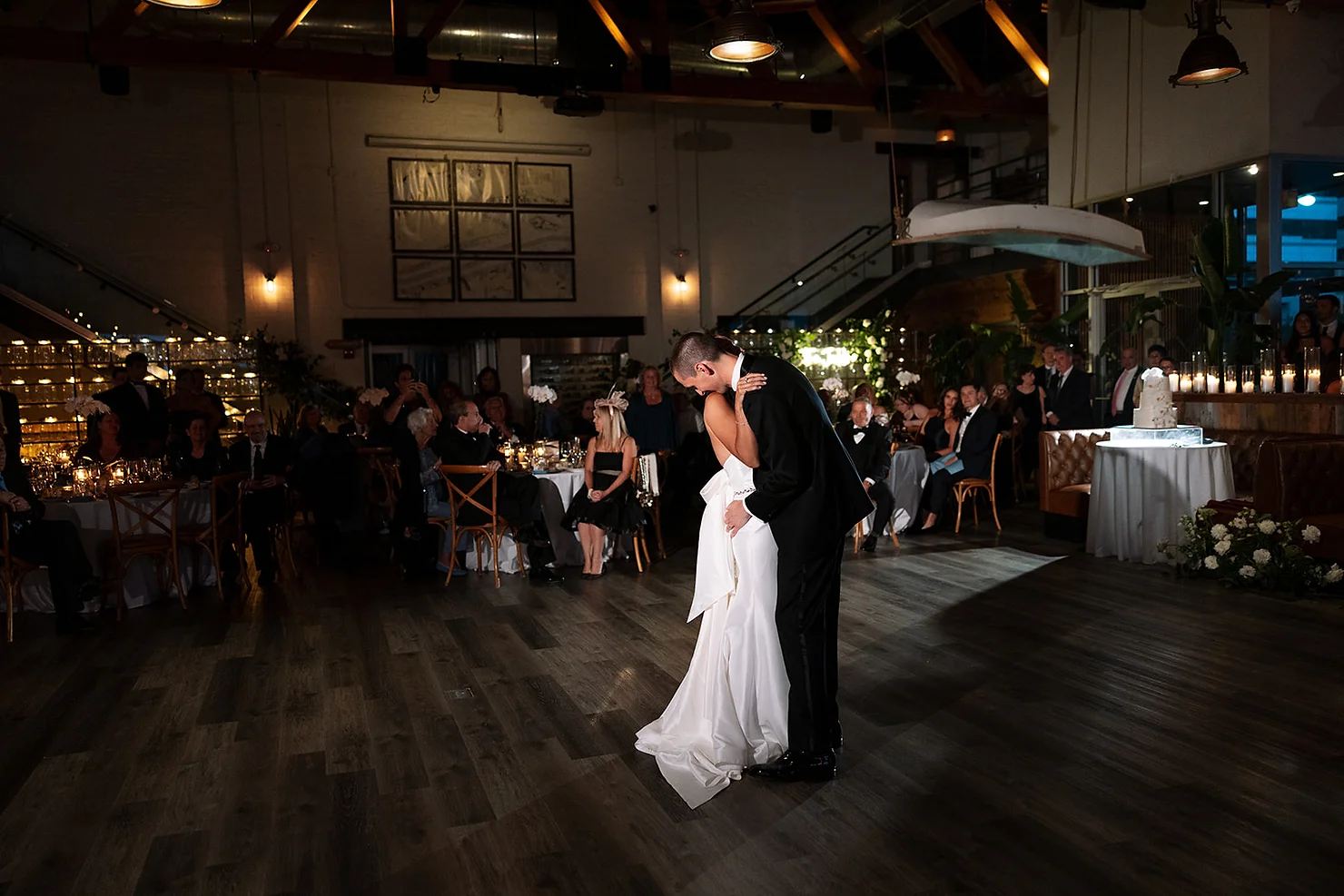 nyc battello wedding dj  Bride and groom kiss on the dance floor at a dim wedding reception