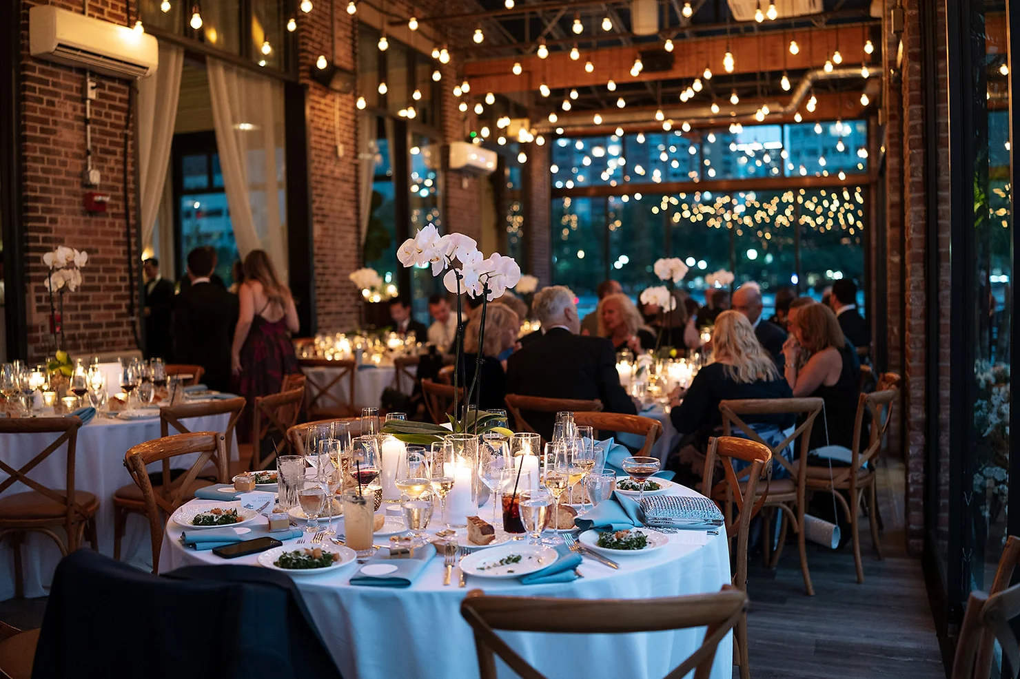 nyc battello wedding dj reception and a beautiful table setup, exposed bricks, and warm lighting