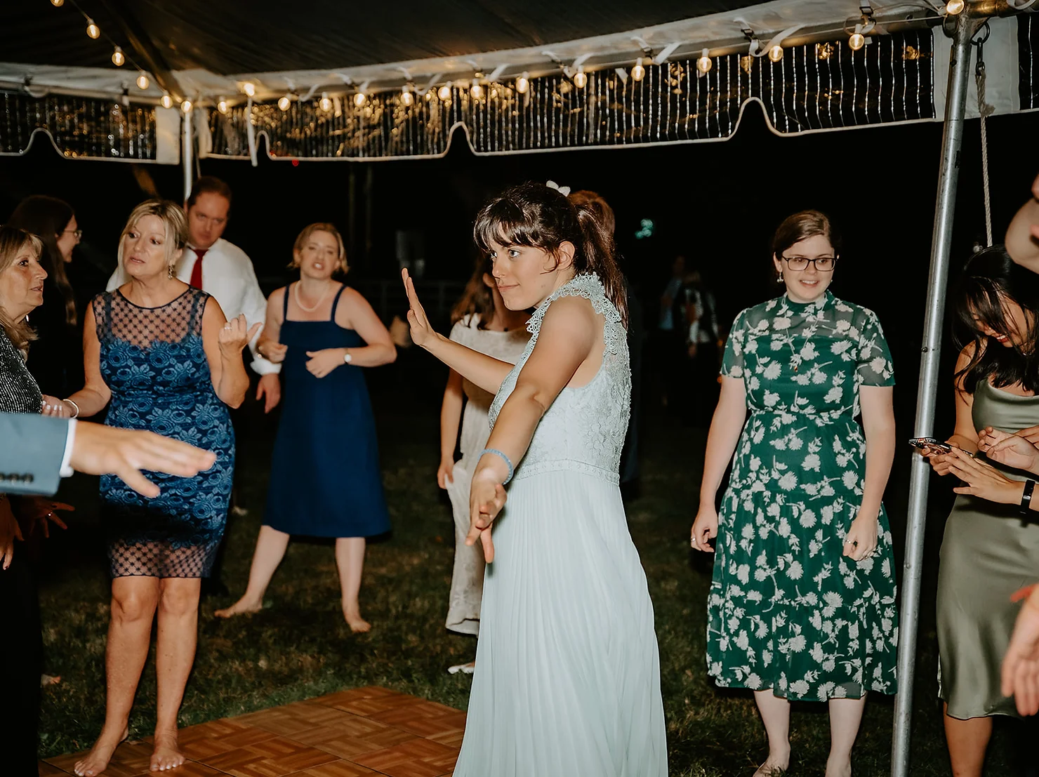 Bride dancing to DJ at wedding