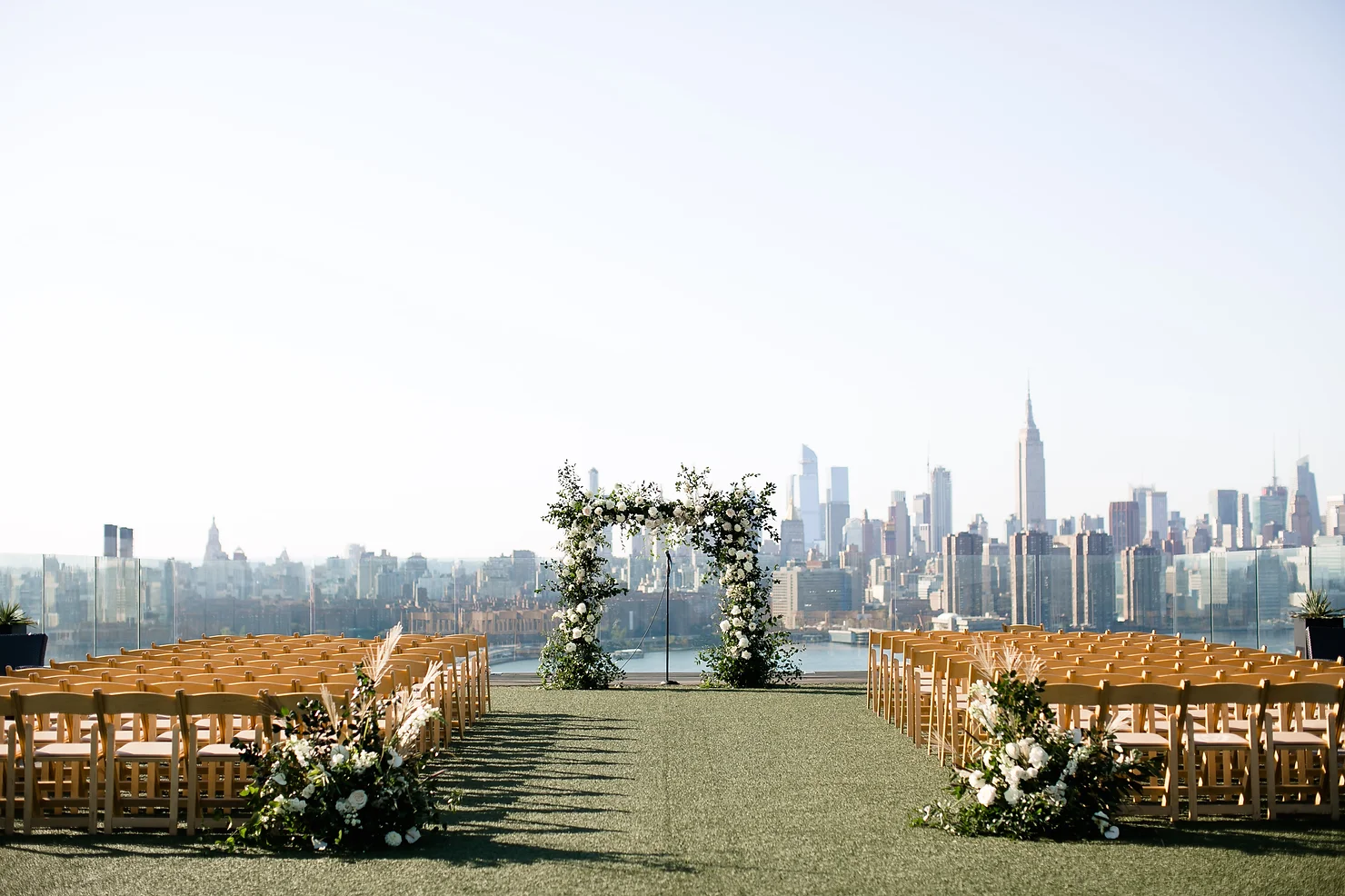 nyc wedding dj the william vale ceremony. sunny day with nyc buildings in the background
