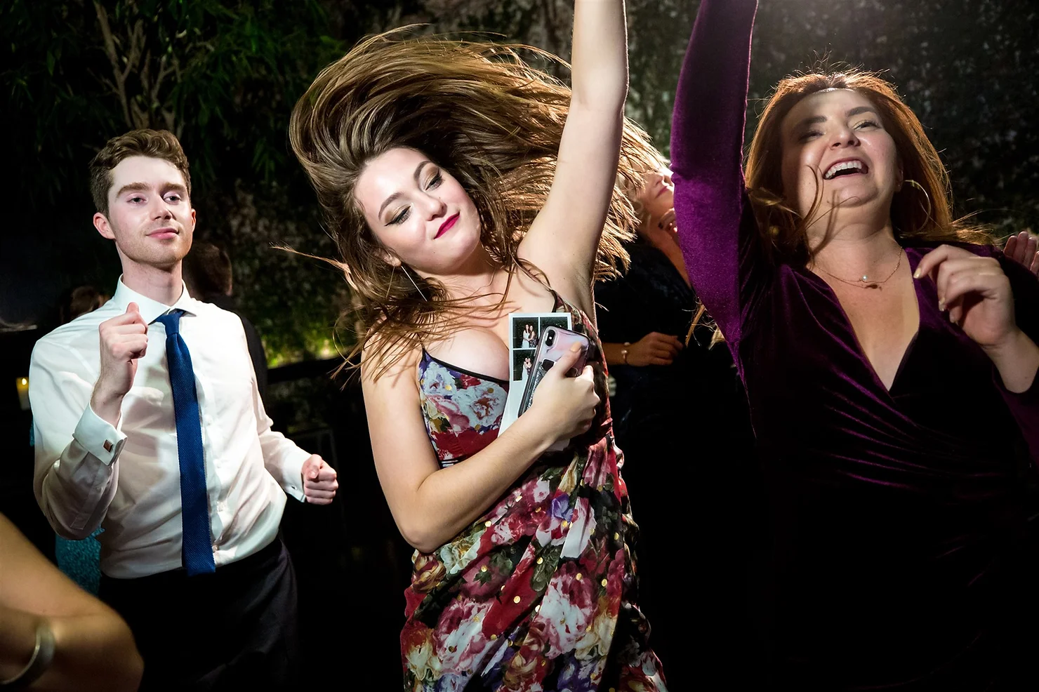 The Foundry nyc non traditional wedding DJ dancing girl with the hair flip along with two other people having fun dancing